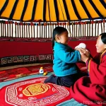 몽골의 불교적 상징 - **Prompt:** A heartwarming scene inside a traditional Mongolian ger (yurt), bathed in soft, natural ...
